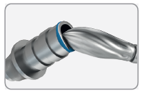 A bur shaping the painted top of a temporary titanium abutment held on the analog.